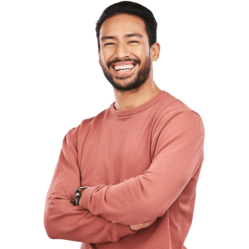 Man smiling with arms crossed