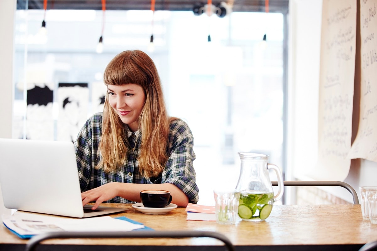 Lady in sitting at laptop 