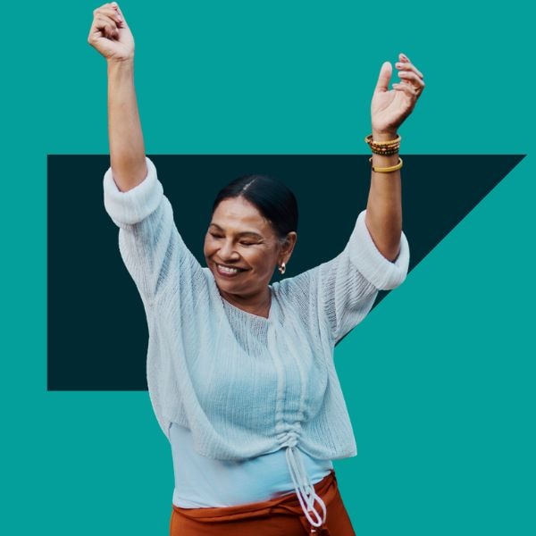 happy woman with her arms up in the air