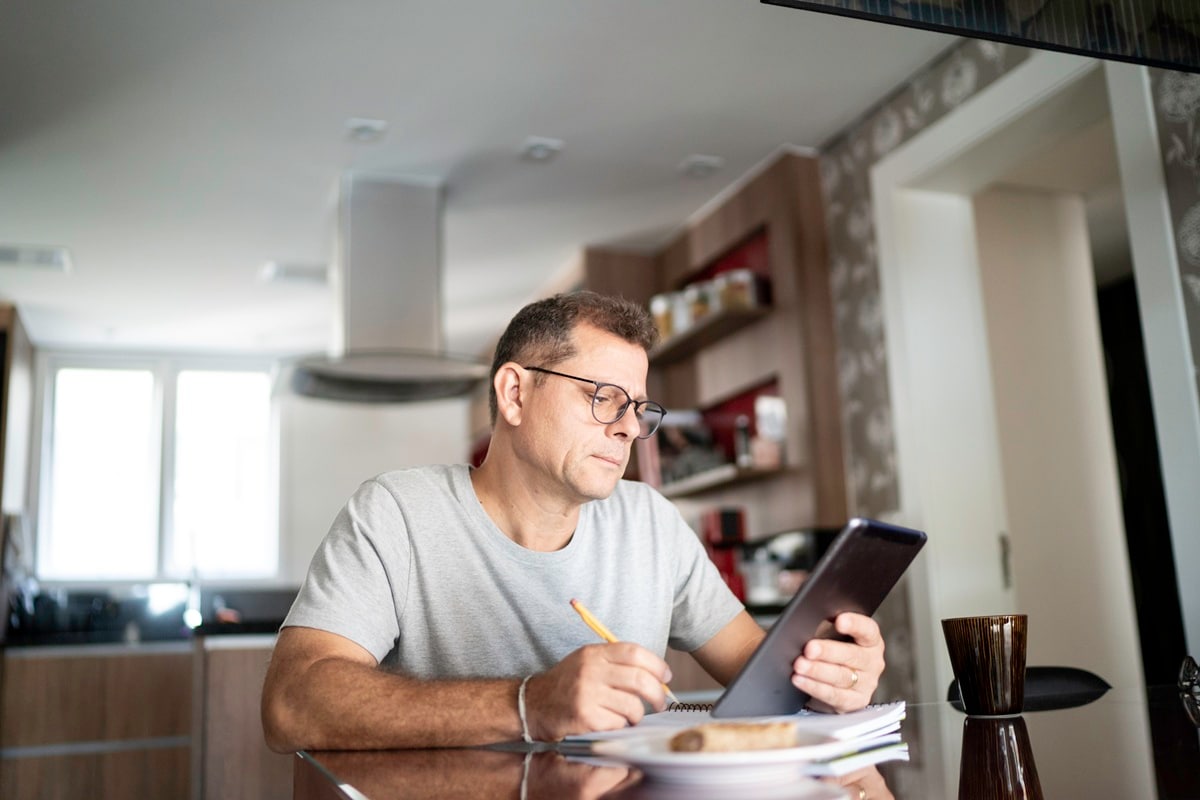 Man looking at tablet