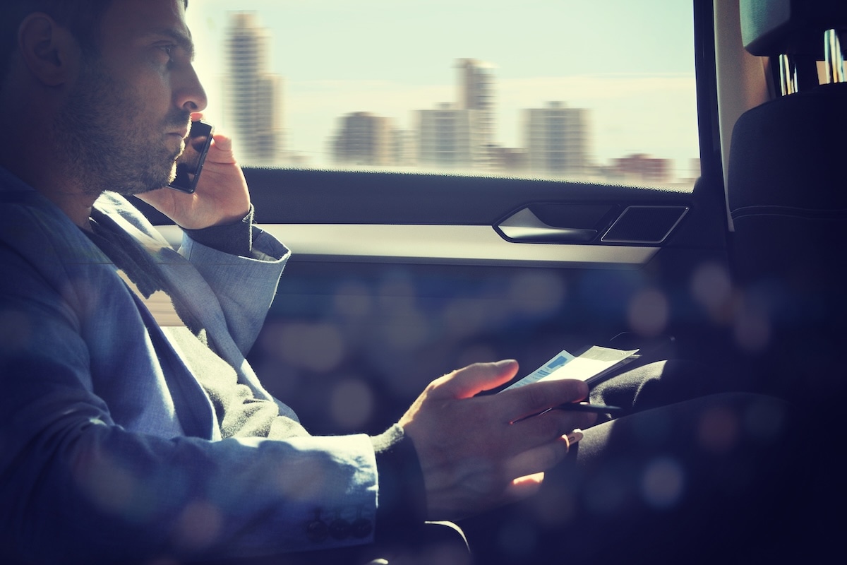 man in taxi on the phone