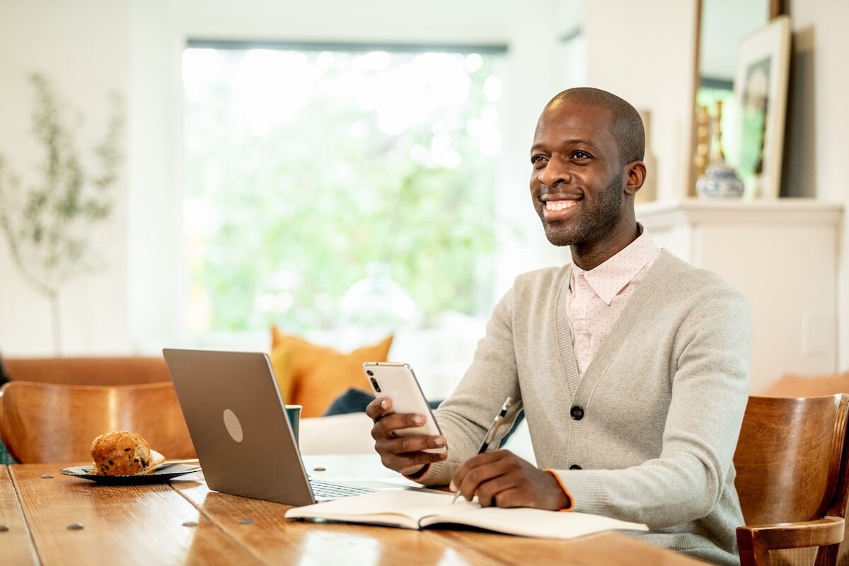 man on phone working at home
