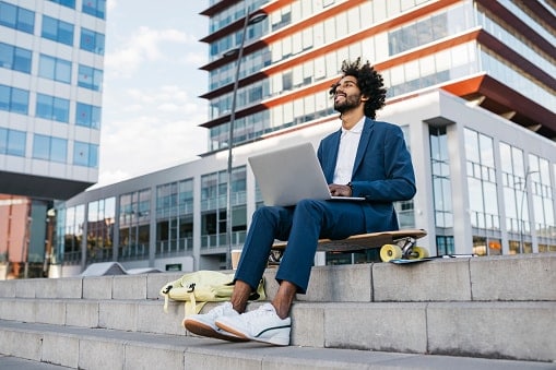 Man sitting on skate board 