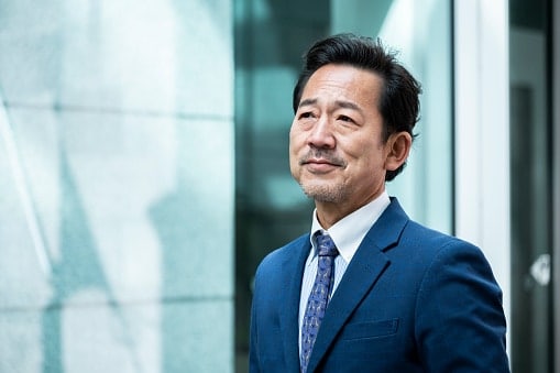 Man in blue suit with blue tie