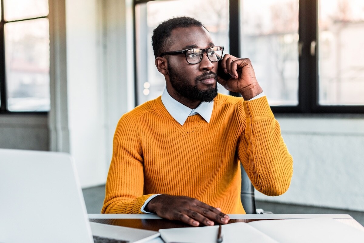 man on phone at desk