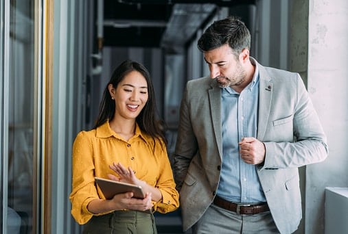 Lady in yellow shirt with man in suit