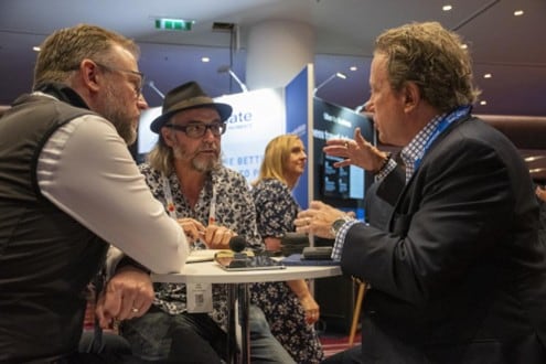 Chris Juneau from SAP Concur and James Lee from Mastercard speak to Jake Smith