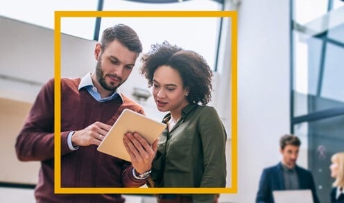 Colleagues looking at a tablet
