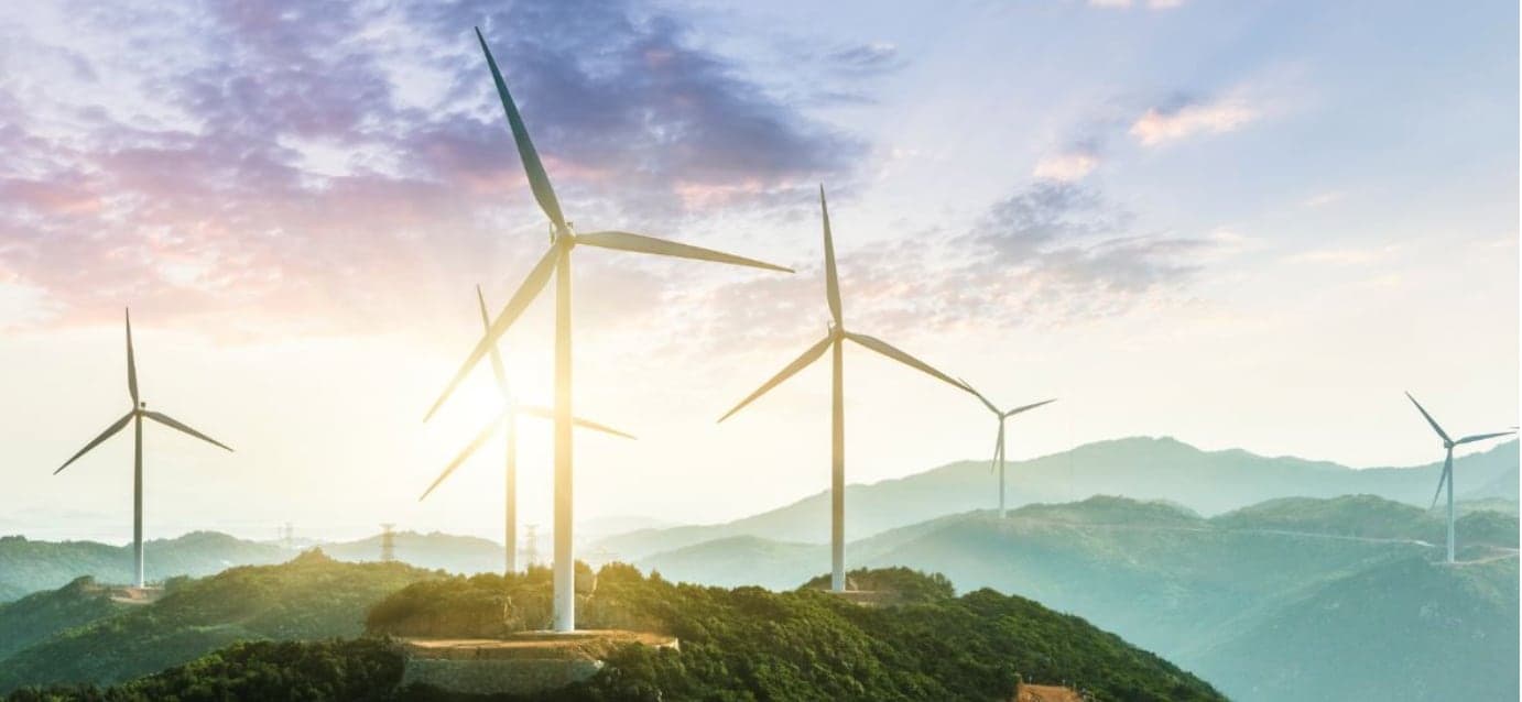 wind turbines on green hill