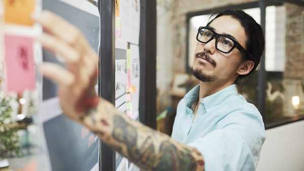 man working on whiteboard