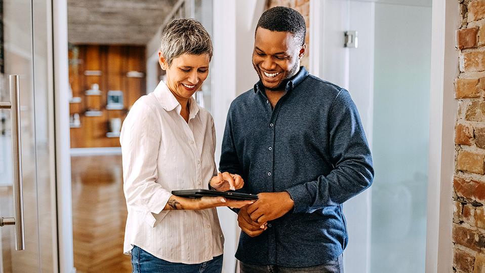 people working on a tablet