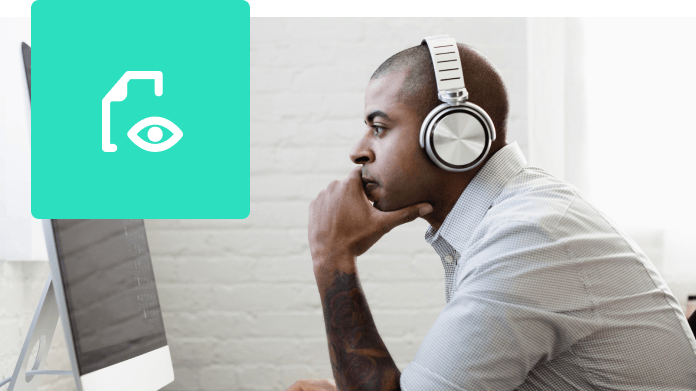 man with headphones watching webinar