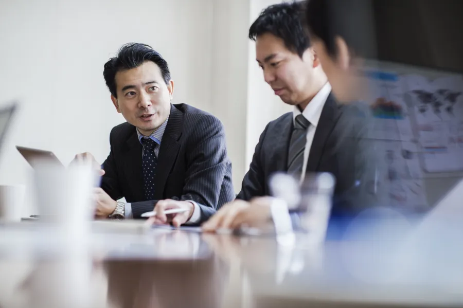 three people working in an office