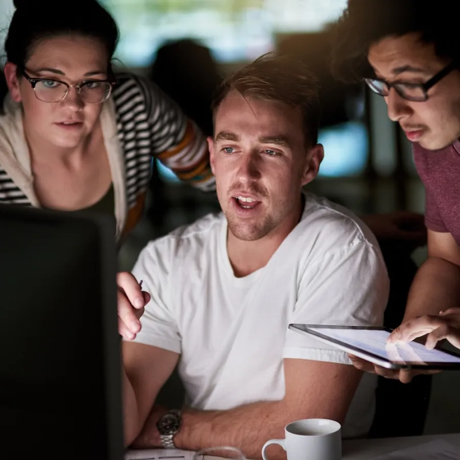 Colleagues looking at a screen