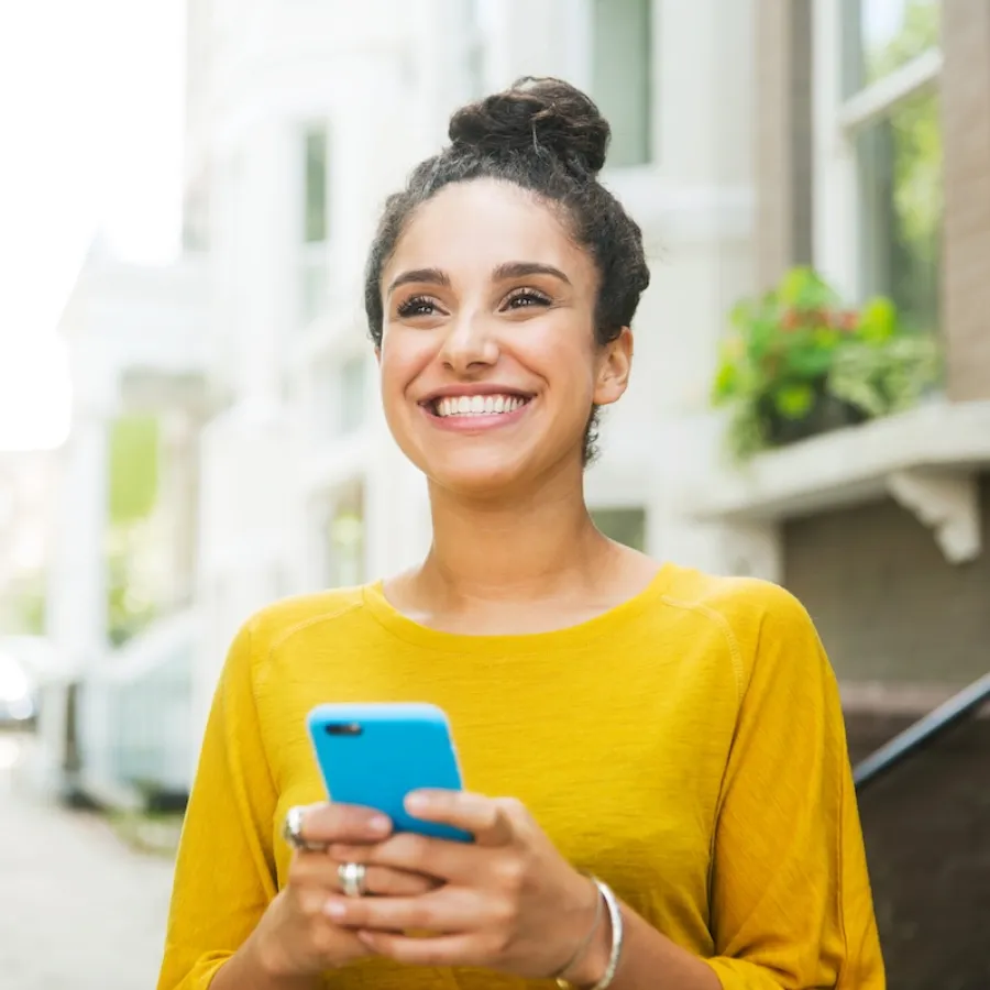 Woman smiling looking at her phone
