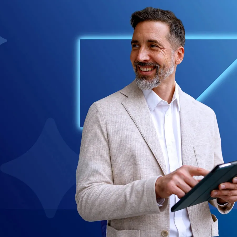 Smiling man looking away from tablet