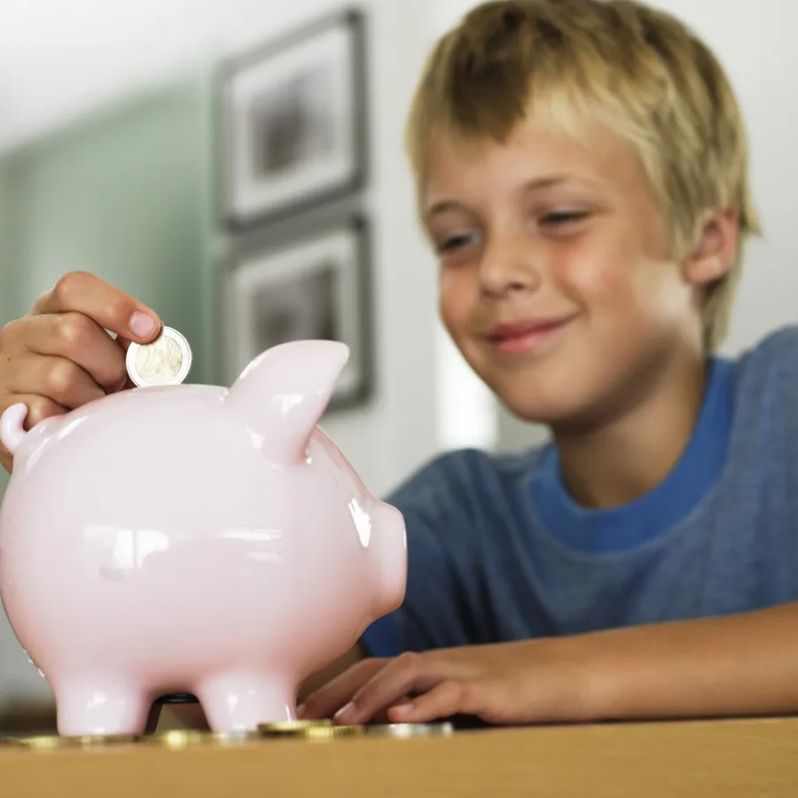 Saving money in a piggy bank