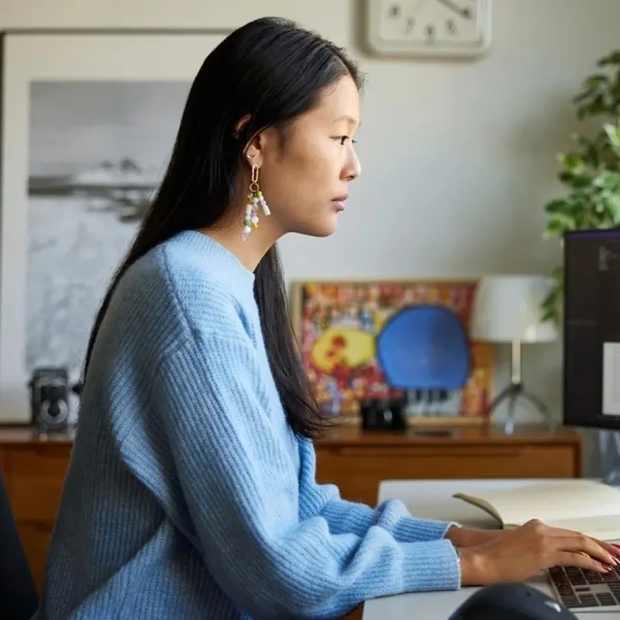 Woman working on dual screens
