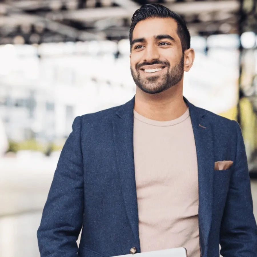 man in blazer smiling
