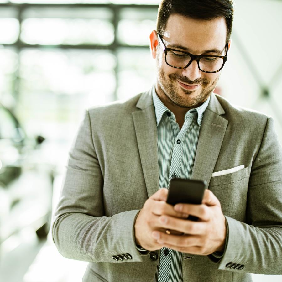 man using app on his phone for travel